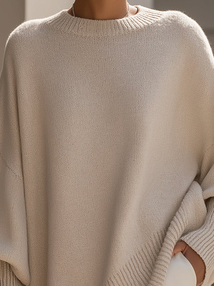 A woman wearing a soft crew neck jumper with jeans for a warm, easy everyday look.