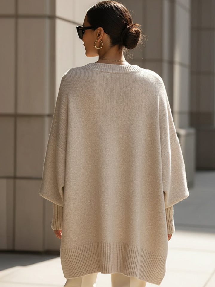 A woman wearing a soft crew neck jumper with jeans for a warm, easy everyday look.