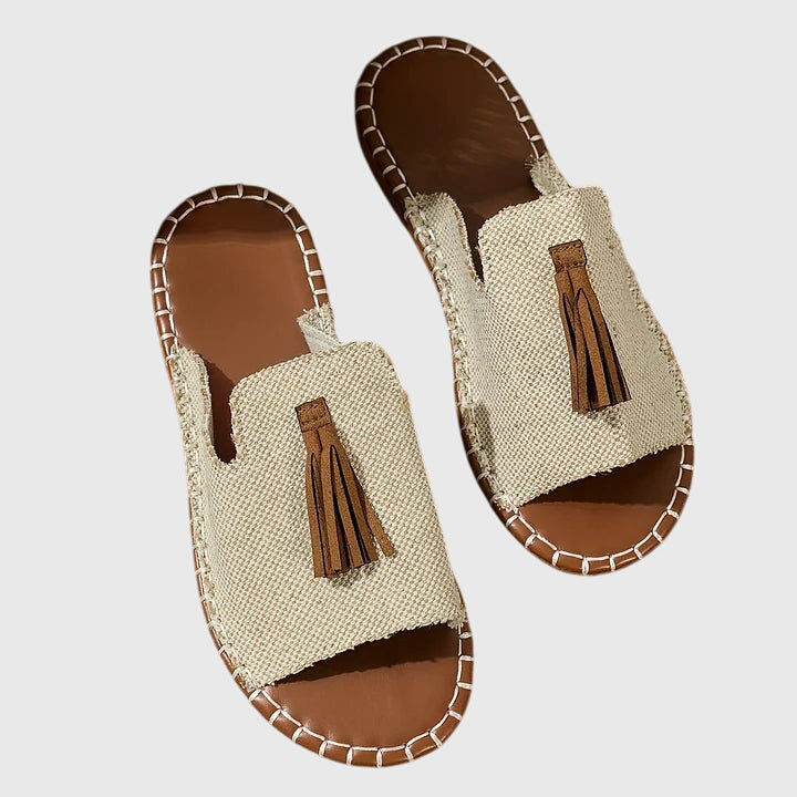 Flat boho sandals with colourful printed upper and swinging fringe detail