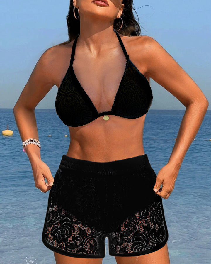 White cutwork high-waist bikini with delicate open-work detailing