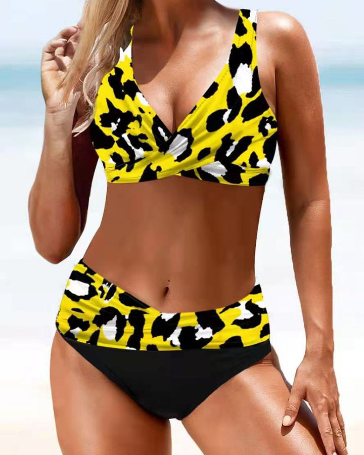 Fuchsia and multicolour crossover bikini with a V-neckline top and colourful bottoms