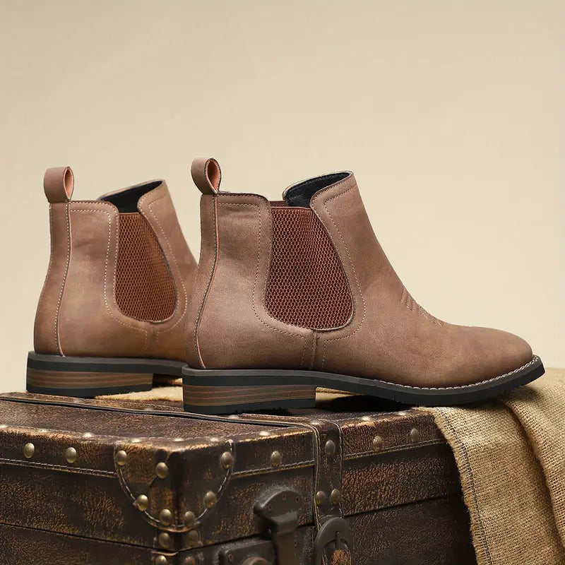 Men's brown smart Chelsea boots with elastic side panels and a sturdy structured sole