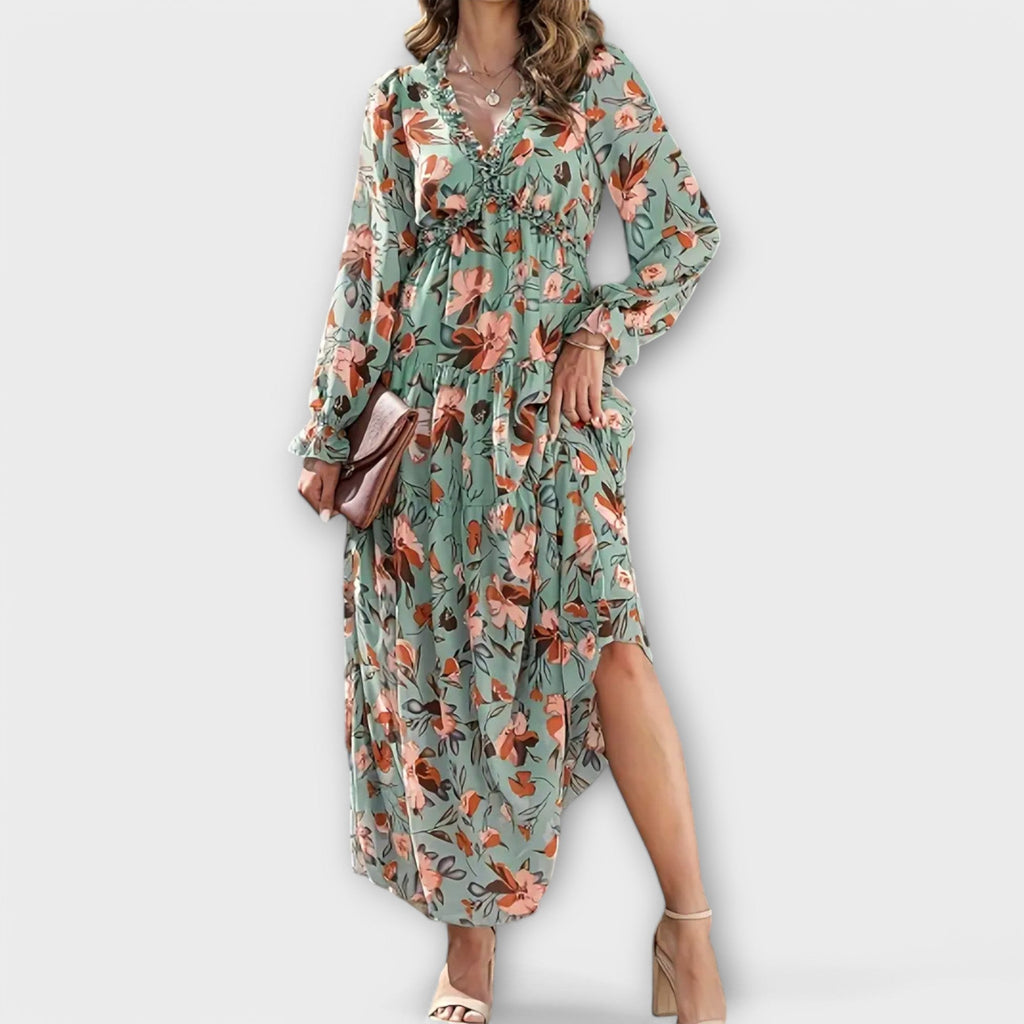 Flowing floral maxi dress with long sleeves and a V-neckline in soft blush pink