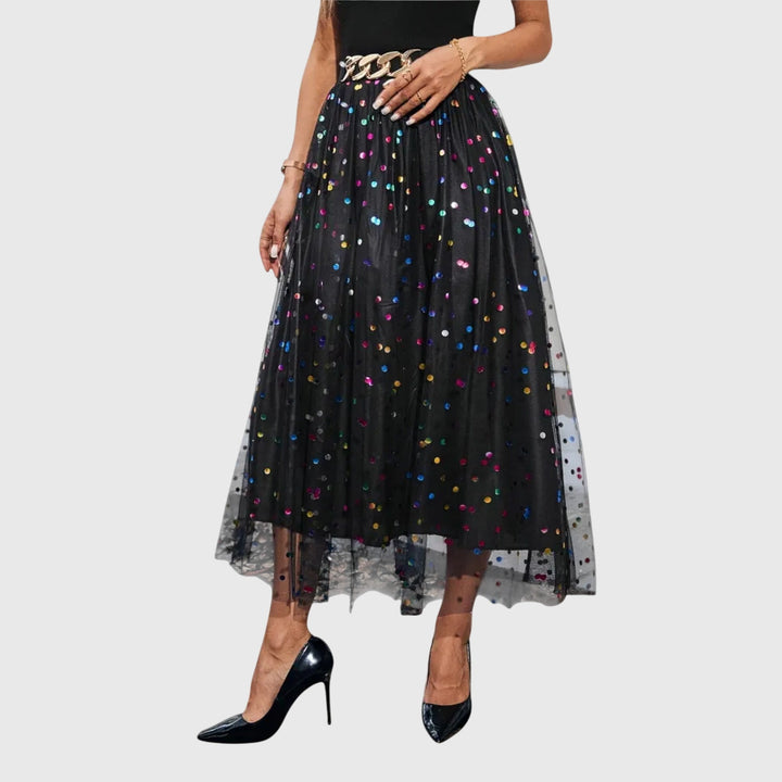 A woman in a light pleated skirt with a flowing fall, styled for an effortless everyday look.
