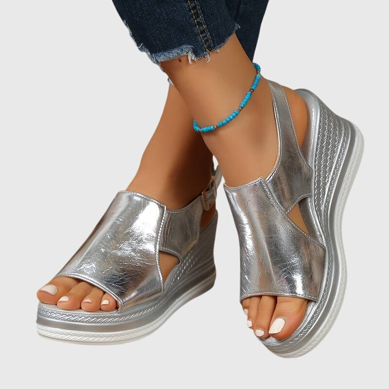 Metallic gold platform sandals with a detailed sole and cushioned footbed
