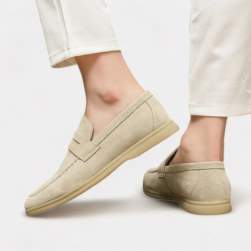 Men's classic slip-on loafers in beige and black with a neat, timeless silhouette