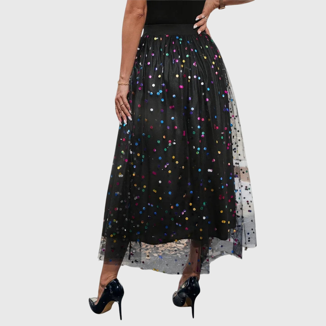 A woman in a light pleated skirt with a flowing fall, styled for an effortless everyday look.