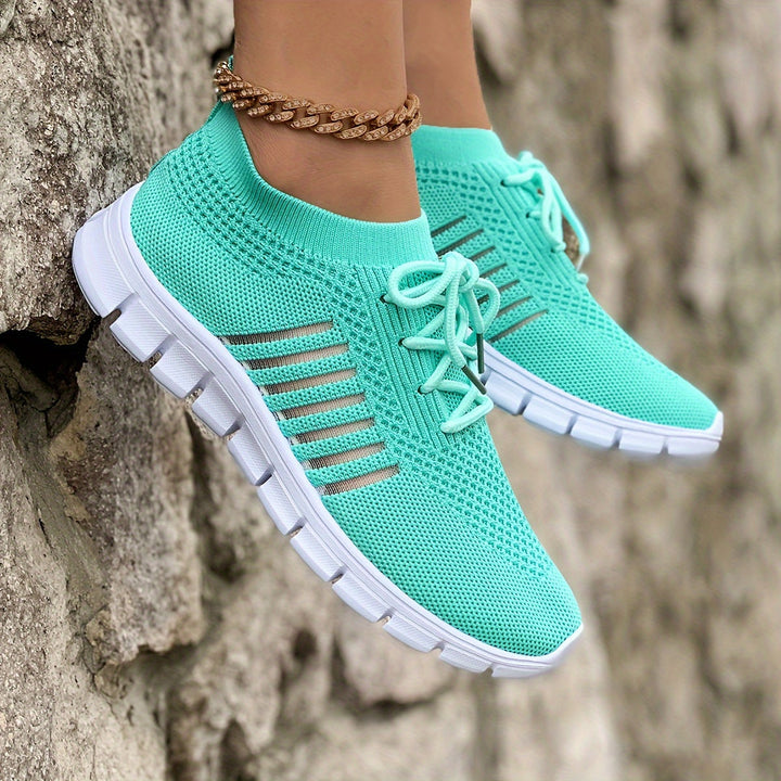 A woman wearing light breathable sock-style comfort shoes