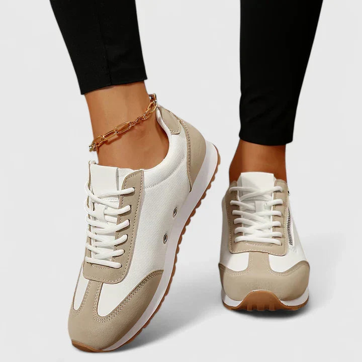 A woman wearing orthopaedic shoes with a supportive heel and a subtle lift