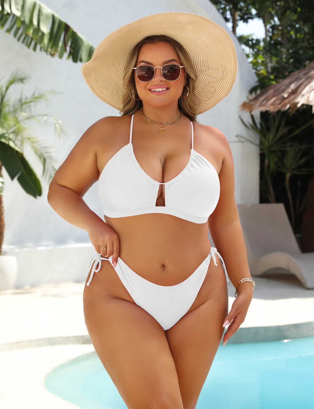 Black high-waist bikini with gold ring detail at the centre of the top