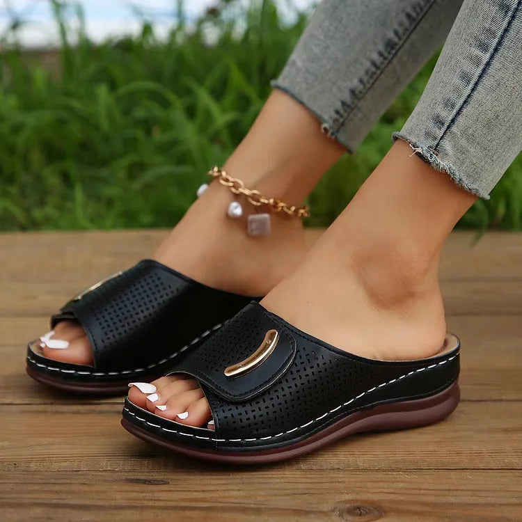Open-work wedge sandals in bordeaux with a small metallic ornament on the upper
