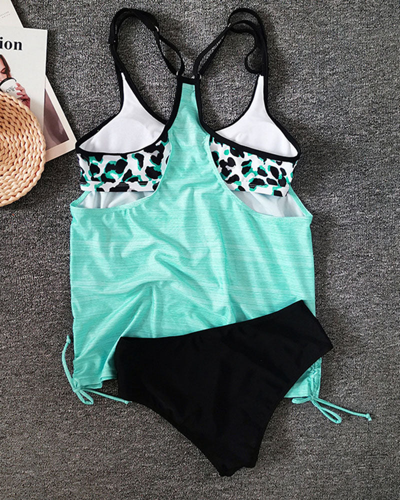 Strappy tankini swimsuit in light blue with a clean, flattering silhouette