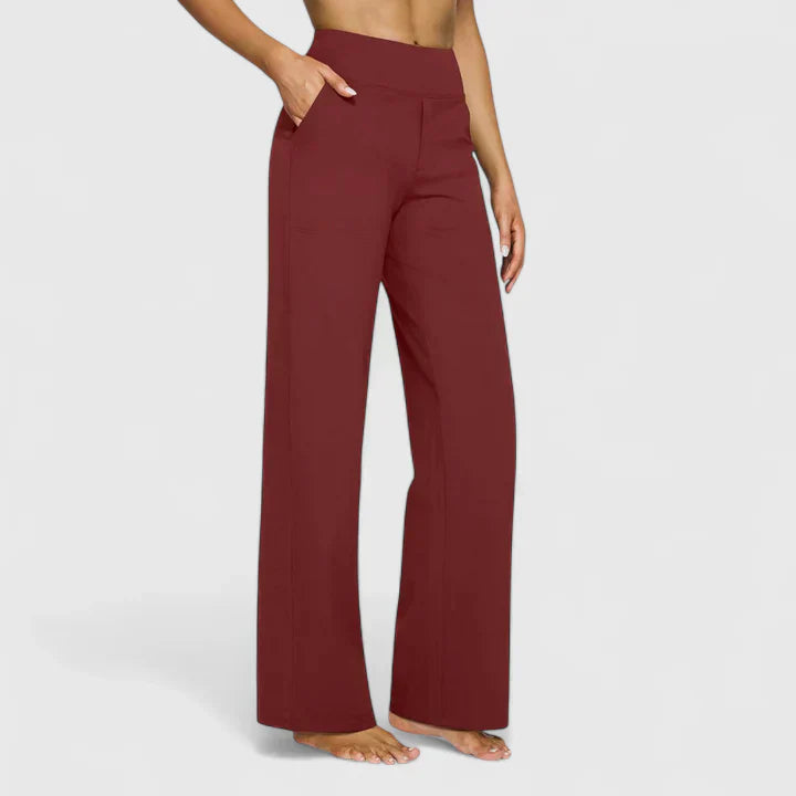 A woman in elegant straight-leg trousers with pockets, styled for a polished everyday look.