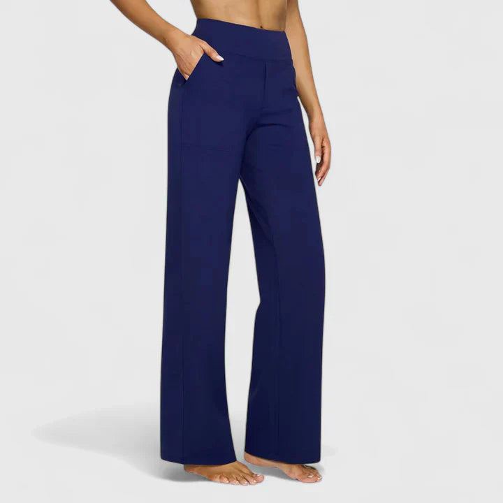 A woman in elegant straight-leg trousers with pockets, styled for a polished everyday look.