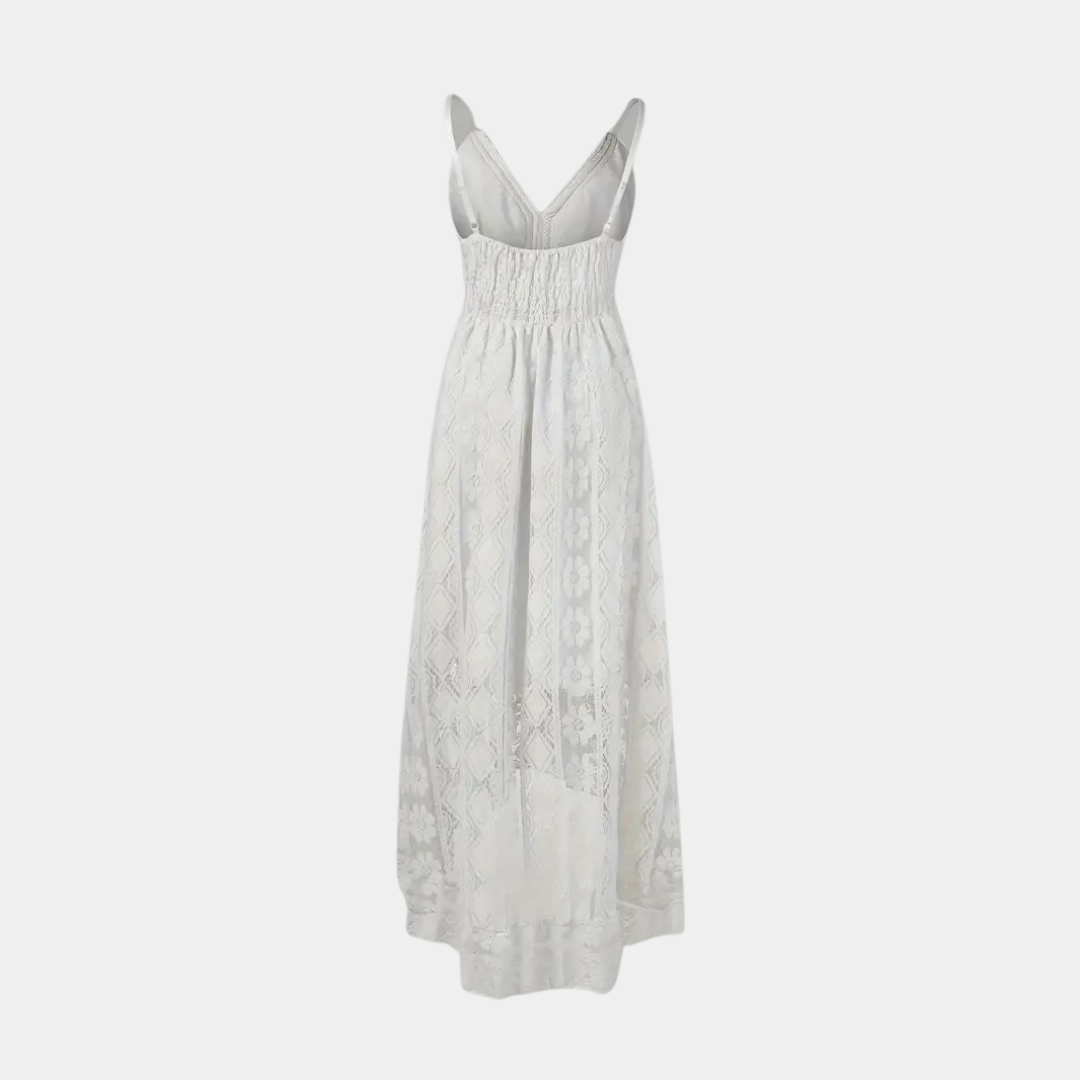 Woman wearing the Alice™ elegant boho midi dress with intricate detailing and a V-neckline at a summer garden party.