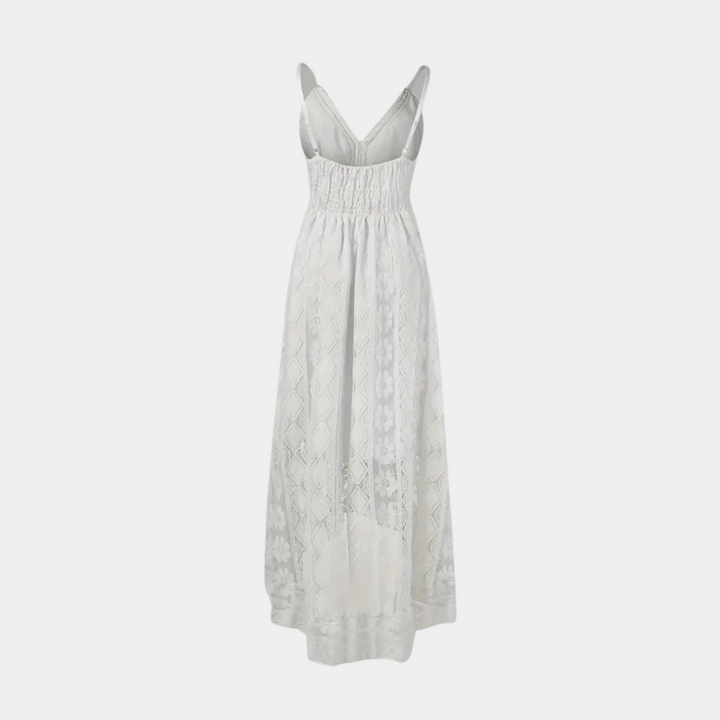 Woman wearing the Alice™ elegant boho midi dress with intricate detailing and a V-neckline at a summer garden party.