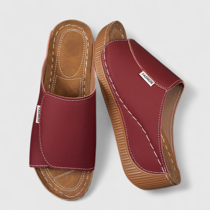 A woman in tan lightweight sandals stepping out gracefully, feet cushioned and supported.