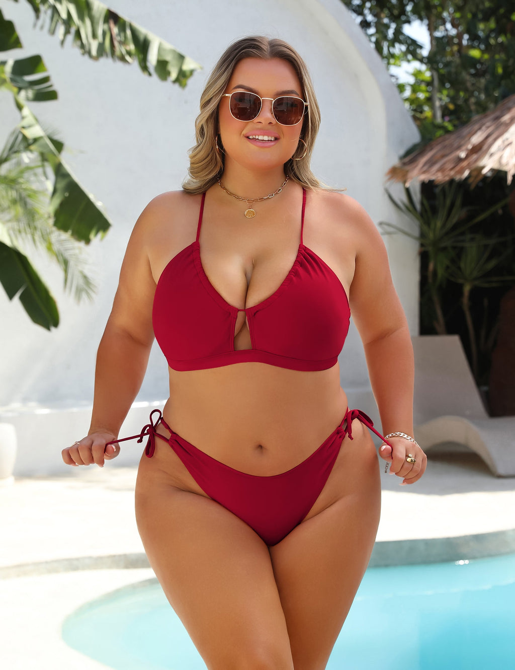 Black high-waist bikini with gold ring detail at the centre of the top
