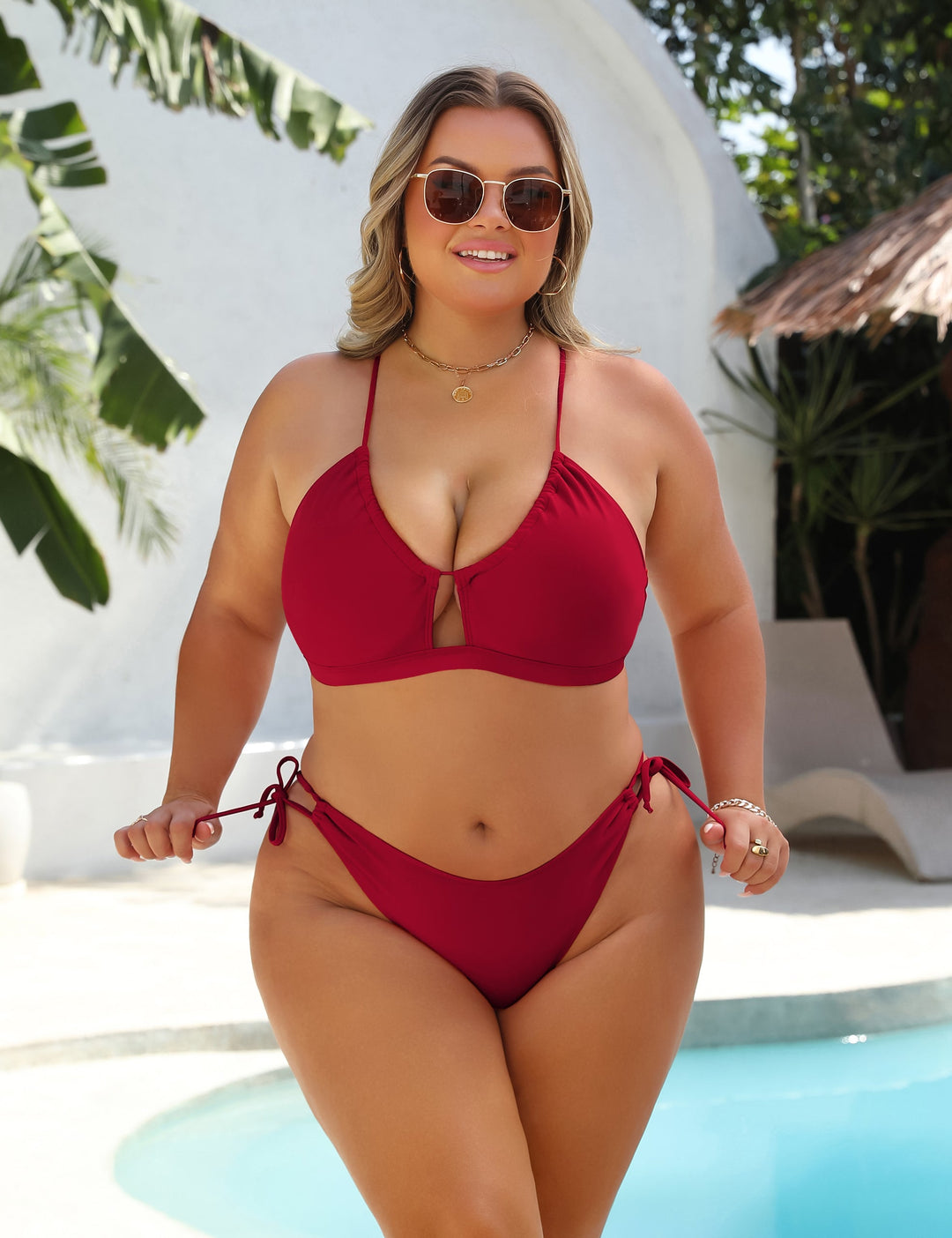 Black high-waist bikini with gold ring detail at the centre of the top