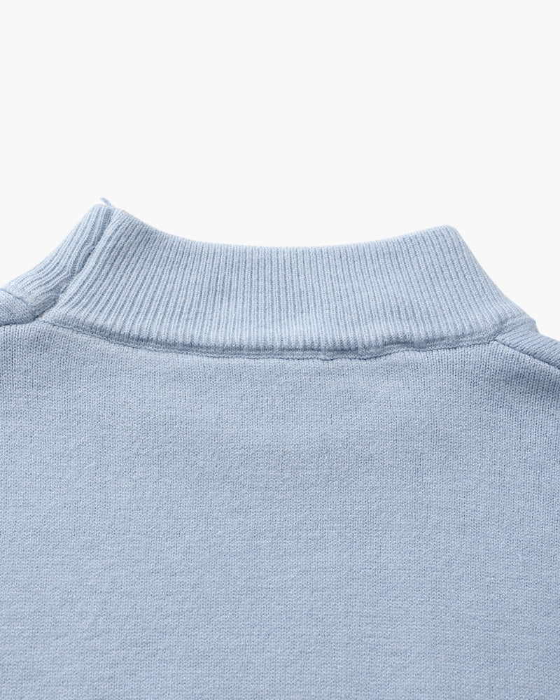 Men's black ribbed roll-neck jumper with a clean structured silhouette