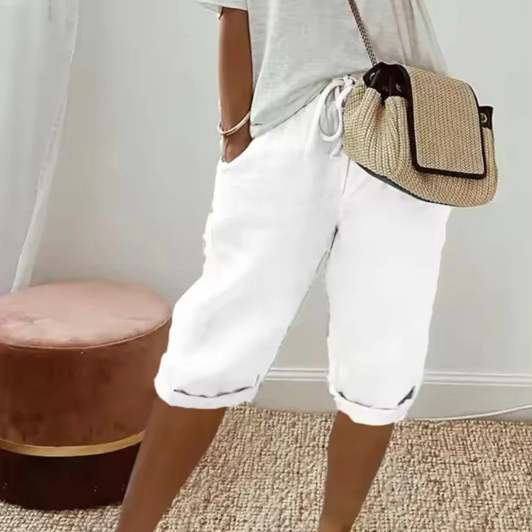 A pair of relaxed-fit summer shorts in beige with an elasticated drawstring waist