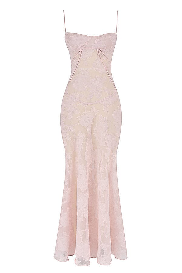 An elegant floor-length occasion dress in blush pink, styled for a formal wedding or gala event