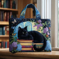 Quilted tote bag featuring a black cat seated on top of stacked colourful books