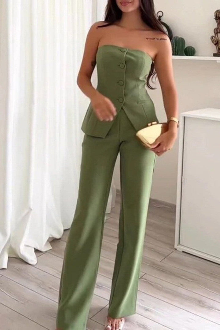 A woman wearing a tailored sleeveless button-detail top with matching wide-leg trousers.