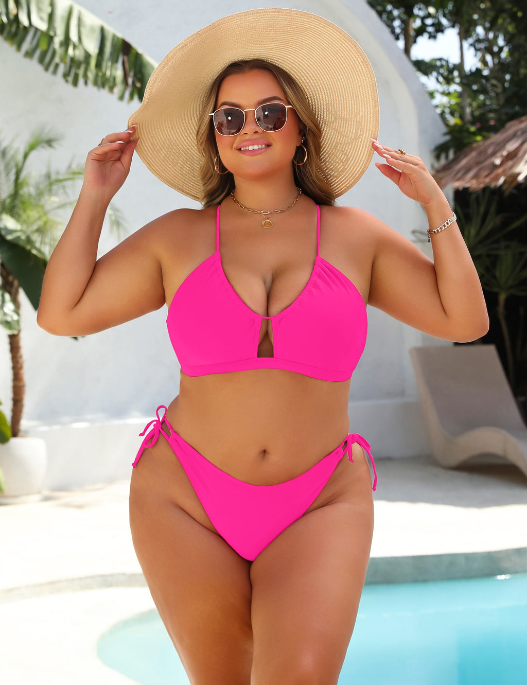 Black high-waist bikini with gold ring detail at the centre of the top