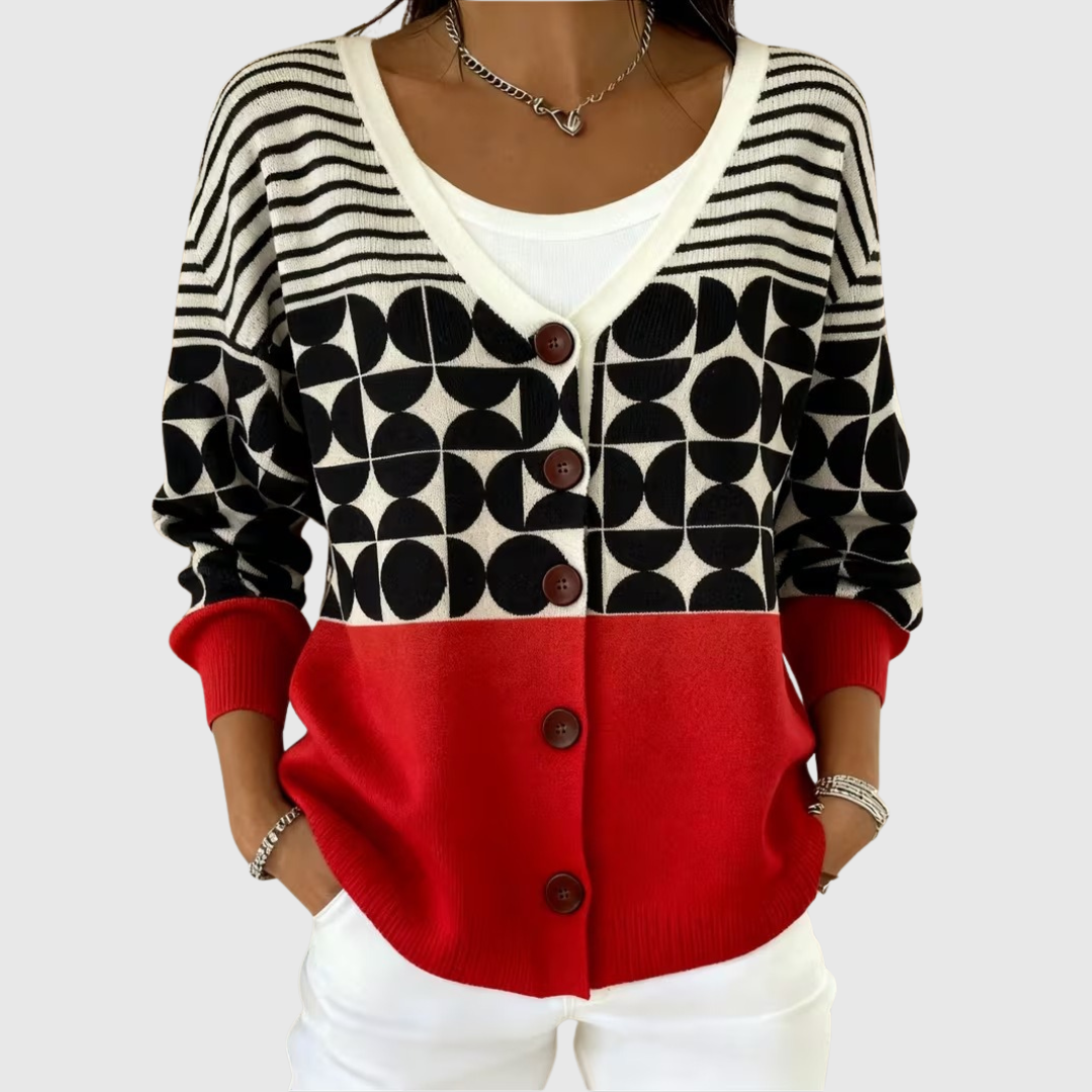 A woman wearing a cosy buttoned cardigan closed over a top, relaxed and comfortable.