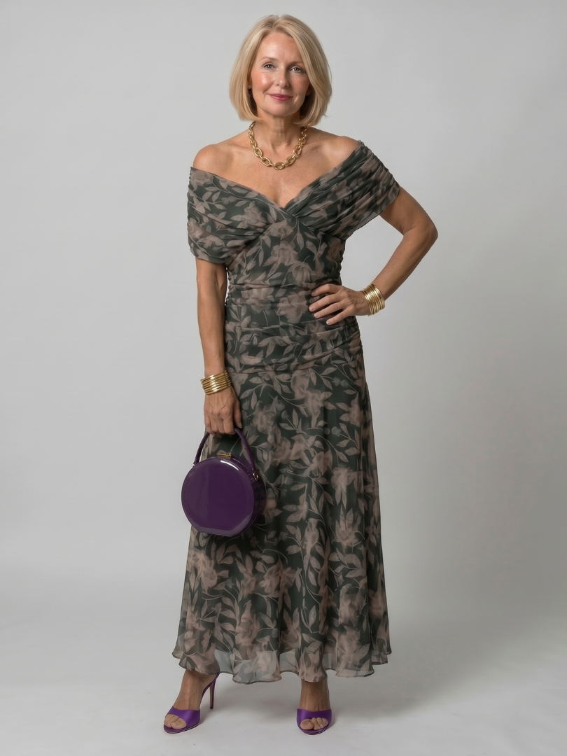 Purple off-shoulder midi dress with draped neckline and gently flared skirt