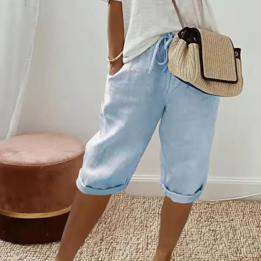 A pair of relaxed-fit summer shorts in beige with an elasticated drawstring waist
