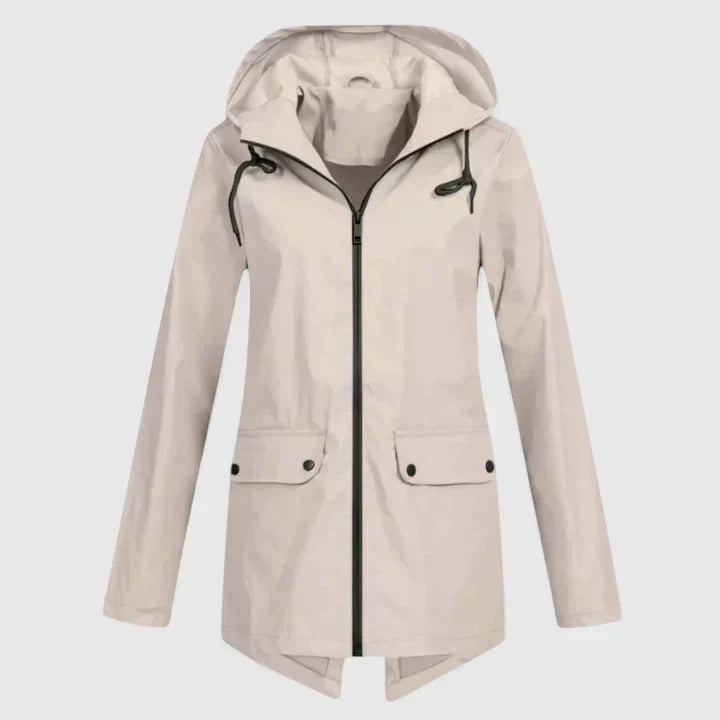 A woman wearing a hooded rain jacket, walking outdoors in light rain