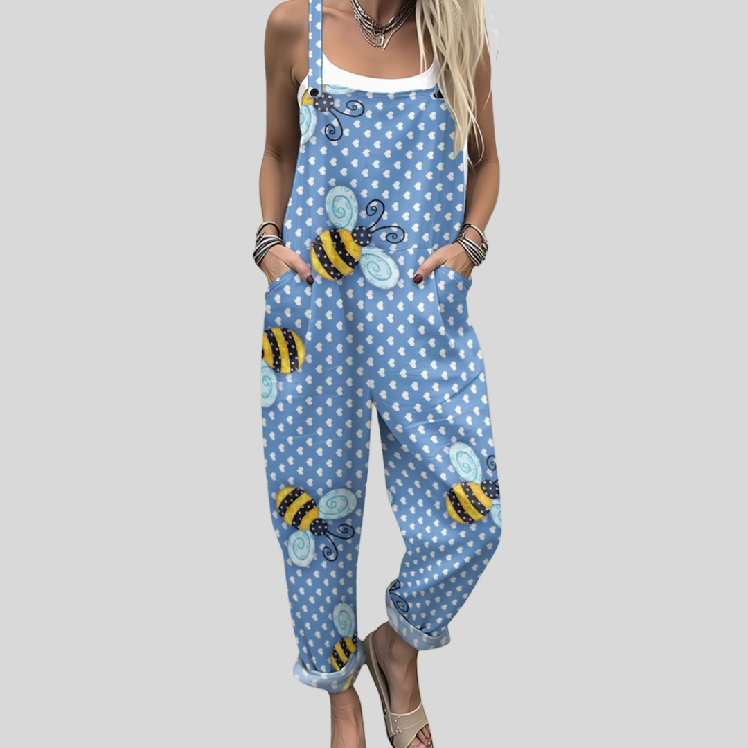 Gormlaith™ wide-leg dungarees in soft sky blue with large golden and black bees and bold white polka dots across the fabric.