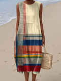 A sleeveless heritage stripe dress in rich earthy tones of terracotta, deep navy and sunny yellow