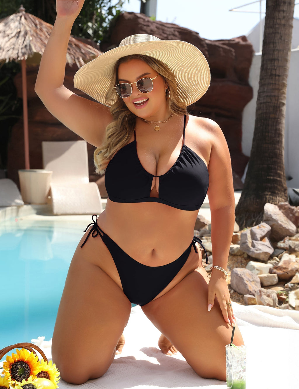 Black high-waist bikini with gold ring detail at the centre of the top