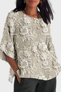 Women's floaty wildflower print top in soft pastel tones with a romantic floral pattern
