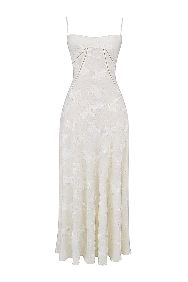 An elegant floor-length occasion dress in blush pink, styled for a formal wedding or gala event