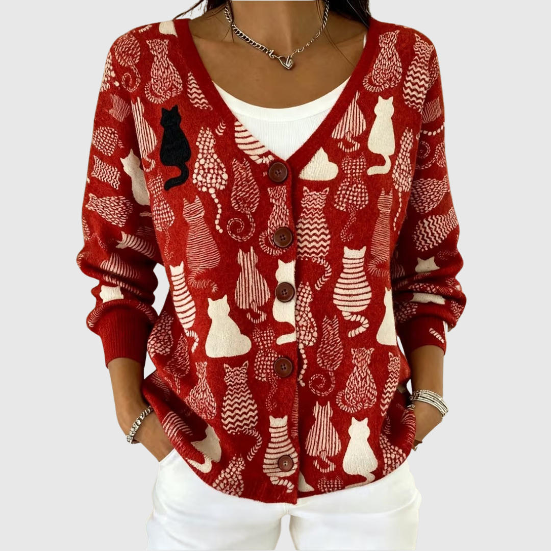 A woman wearing a classic buttoned cardigan open over a simple top on a mild autumn day.