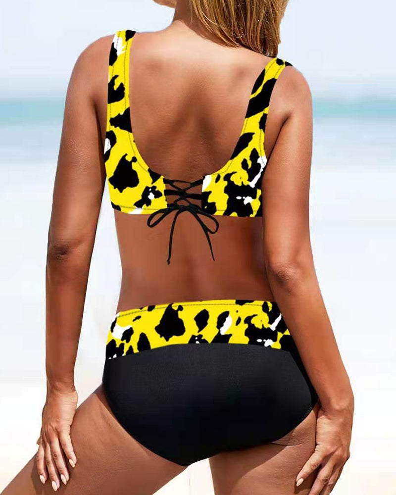 Fuchsia and multicolour crossover bikini with a V-neckline top and colourful bottoms