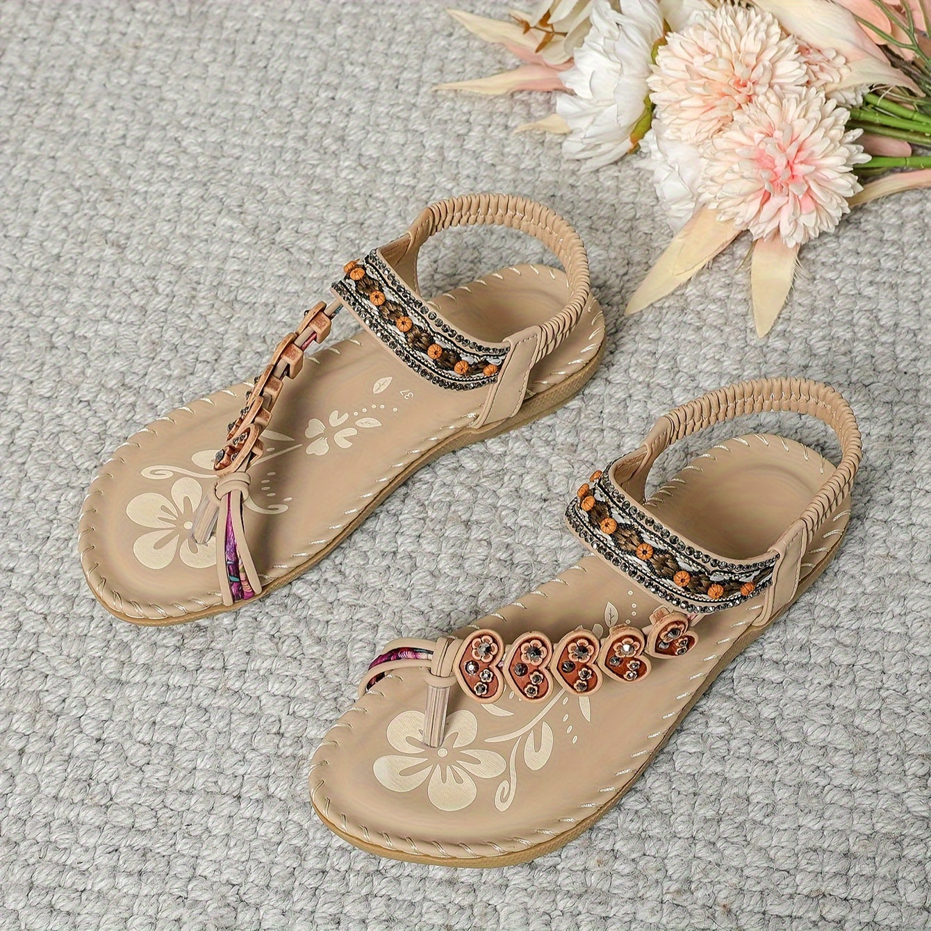 Beaded boho flat sandals in brown with decorative bead detailing and an elastic ankle strap