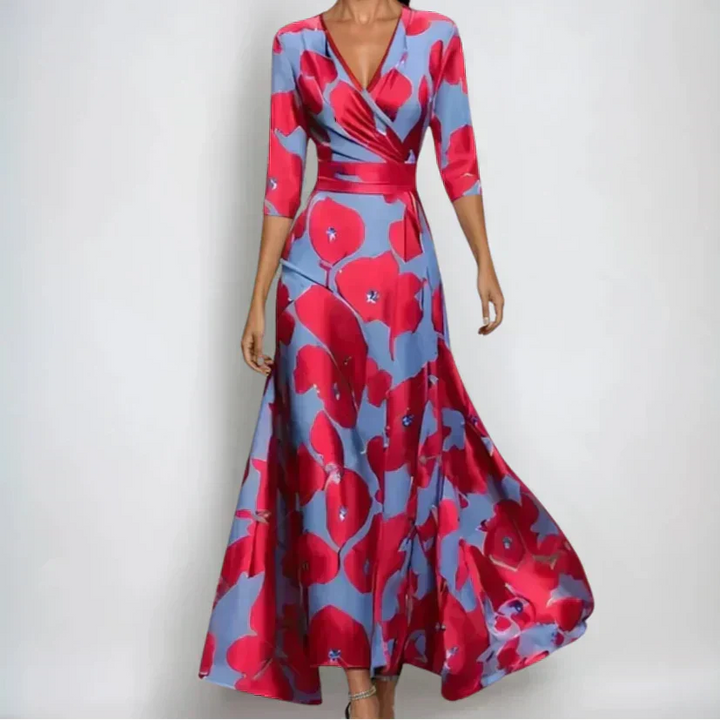 Woman wearing the Claire floral midi dress with wrap neckline and flowing skirt at a celebration.
