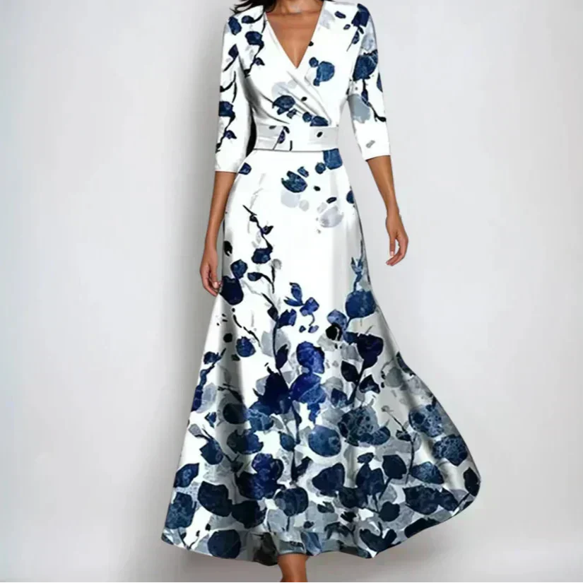 Woman wearing the Claire floral midi dress with wrap neckline and flowing skirt at a celebration.