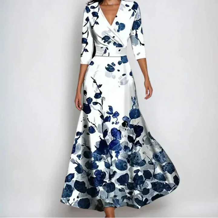 Woman wearing the Claire floral midi dress with wrap neckline and flowing skirt at a celebration.