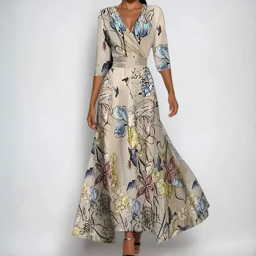 Woman wearing the Claire floral midi dress with wrap neckline and flowing skirt at a celebration.