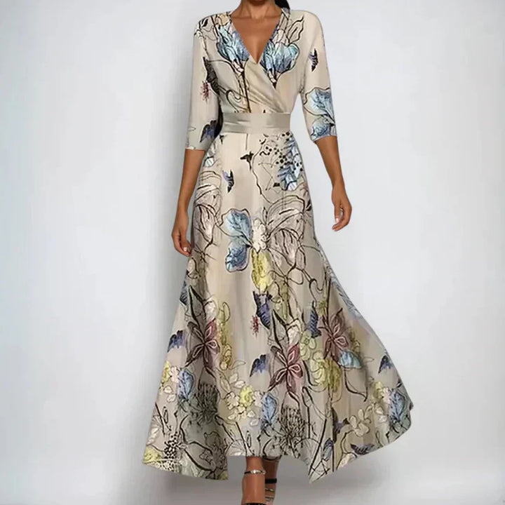 Woman wearing the Claire floral midi dress with wrap neckline and flowing skirt at a celebration.