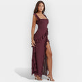 Women's floaty dress in burgundy with a thigh-level slit and delicate ruffle detail