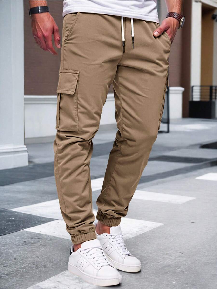Men's modern urban cargo trousers in beige with cargo pockets and elasticated ankle cuffs