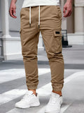 Men's modern urban cargo trousers in beige with cargo pockets and elasticated ankle cuffs