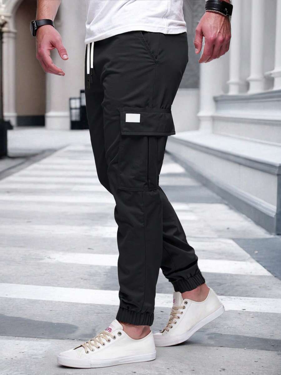 Men's modern urban cargo trousers in beige with cargo pockets and elasticated ankle cuffs